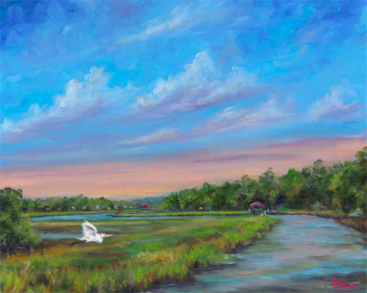 Egret flying over Ellis Creek on James Island near Charleston SC
